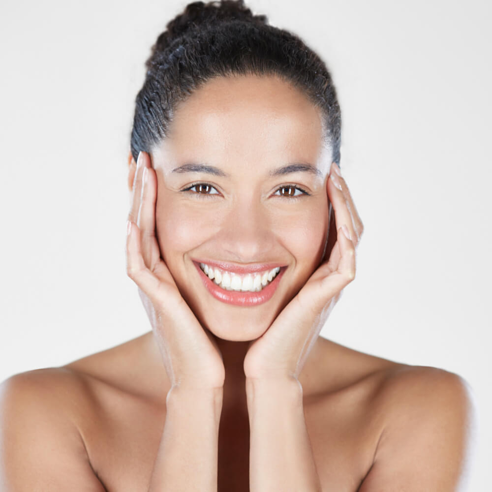 celebrity model touching her face